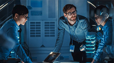Data scientists in a room discussing plans
